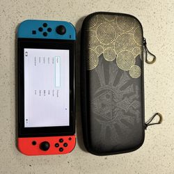 Nintendo Switch Console with Red and Blue Joy Cons