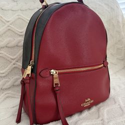 red coach backpack with gold details 