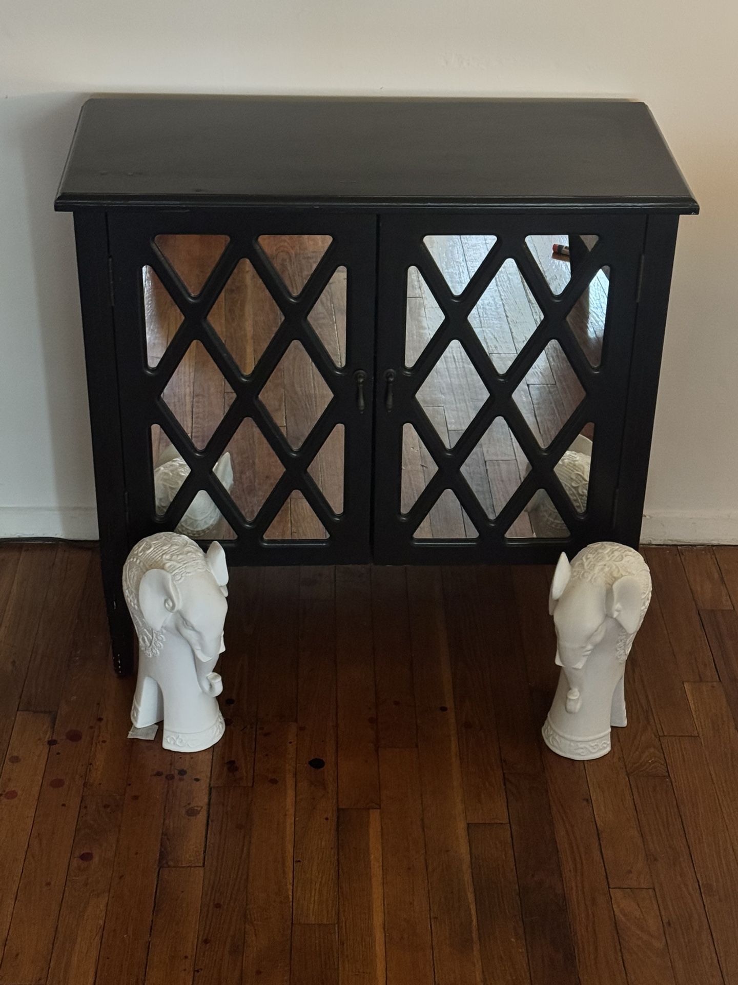 Stylish Black Mirrored Cabinet with Lattice Doors – Includes Decorative Ram Sculptures