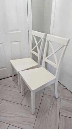 Two white Dining chairs. wood