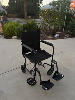 Black Transport Wheelchair with Footrests