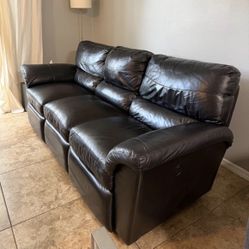 Black Leather Reclining Sofa .Price Including Delivery 