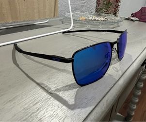Black with blue lens 0akley ejector