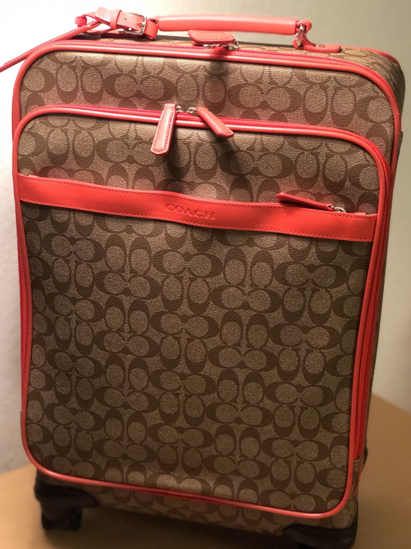 New carry on COACH rolling suitcase