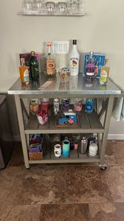 Rolling bar cart with galvanized steel top