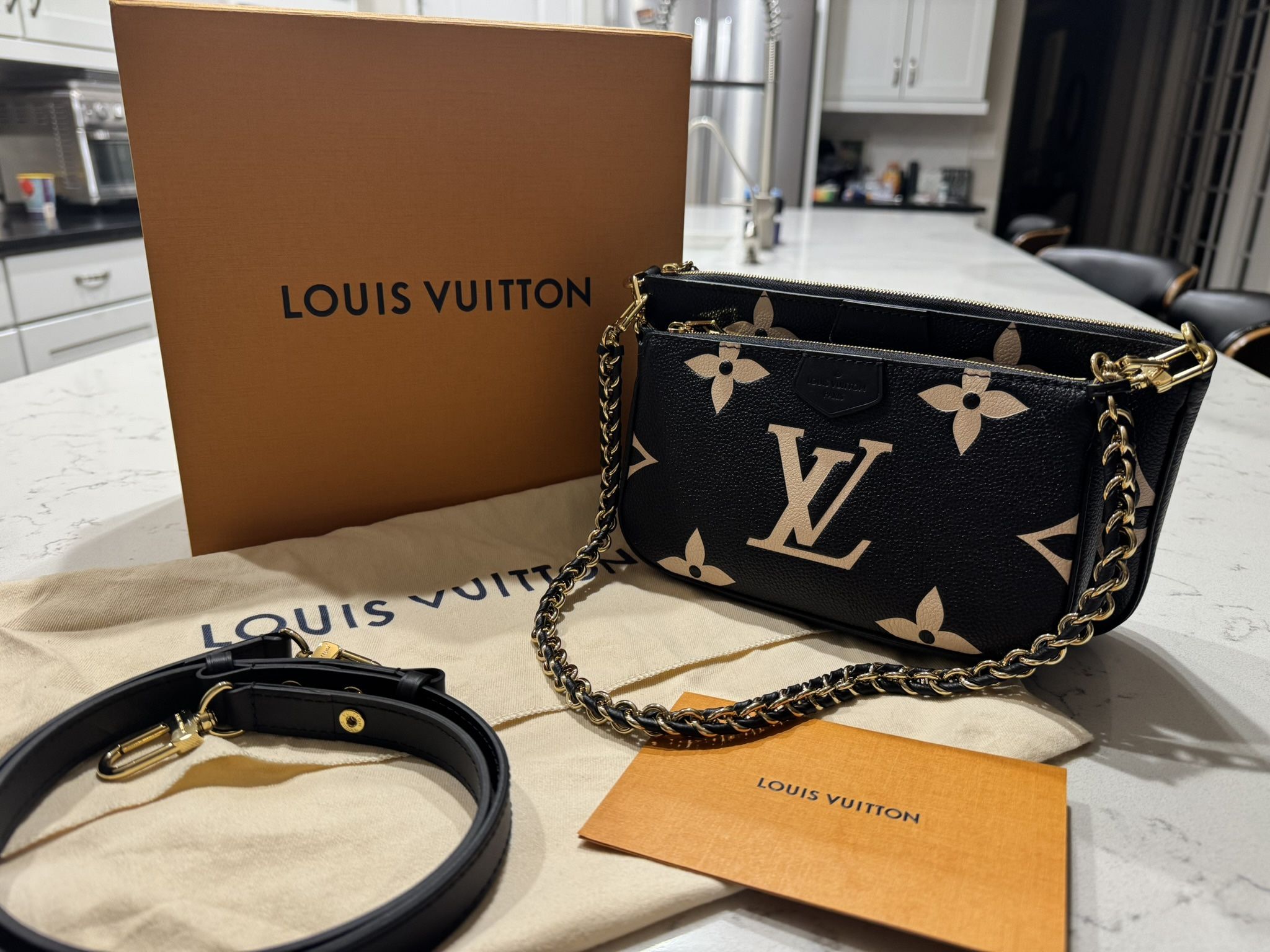 Authentic Louis Vuitton Empreinte Bicolor Multi Pochette