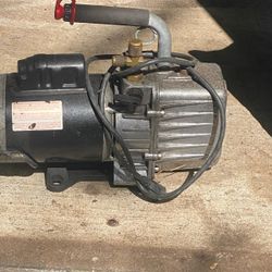 Air conditioner, vacuum pump