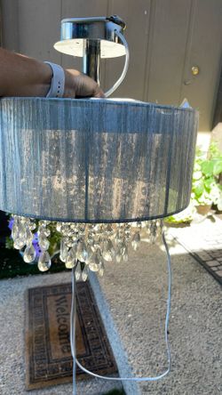 White fabric chandelier with hand strung acrylic rain drops