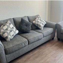 Selling 2 Brand New Gray Couches