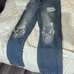 Madewell women's relaxed denim Jeans with a distressed medium wash Size 5/27