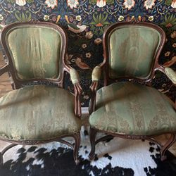 2 wood frame upholstered chairs