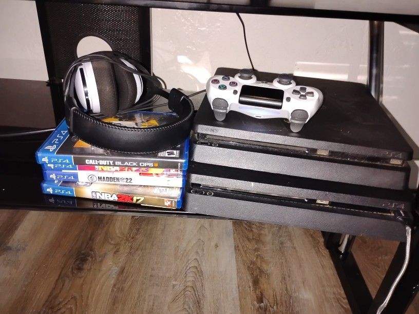 2 PS4 Slims With A White Controller And Headset