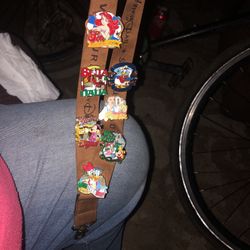 DISNEY SET OF 7 PINS ON DISNEY LANDARD