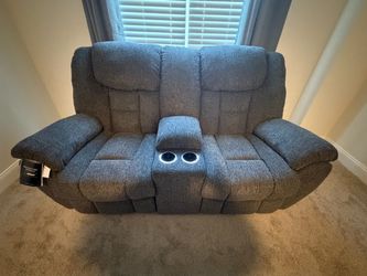 BRAND NEW Ashley Manual Reclining Loveseat with Storage Console – Tags Still On!