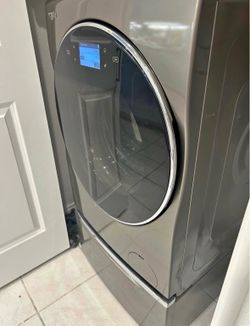 Whirlpool gold, touch screen all in one stainless steel washer / dryer combo.