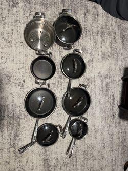 All-Clad pots and pans with lids