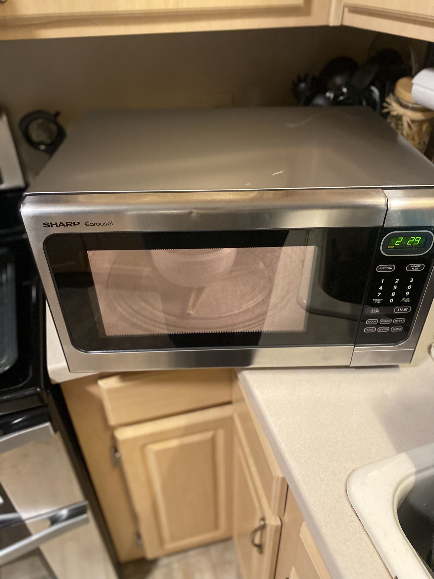 Sharp Carousel R408LS 1.4 cu. ft. Countertop Microwave Oven with 1,100 Watts.