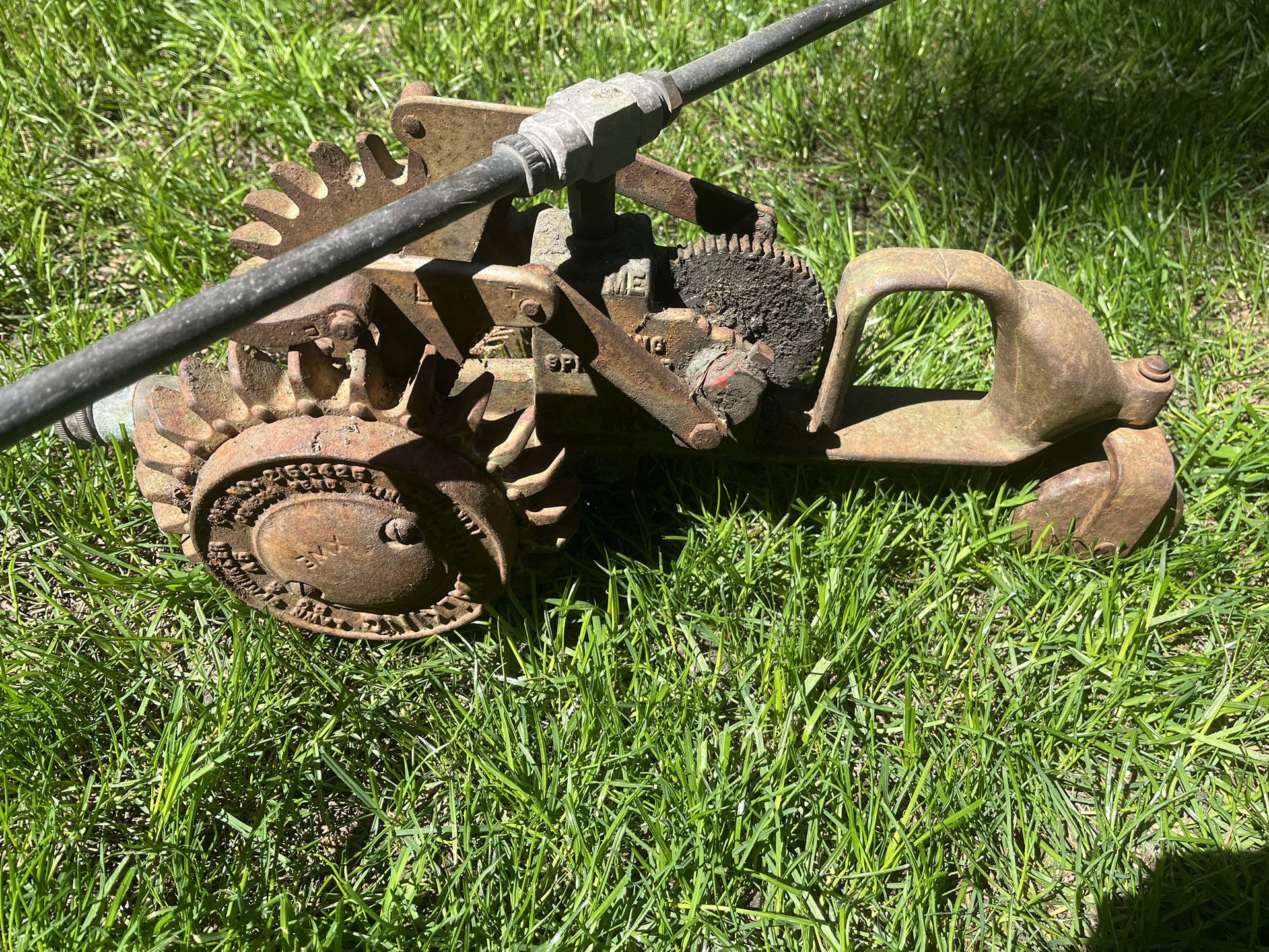 Vintage Cast Iron Walking Lawn Sprinkler