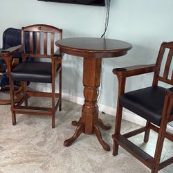 Pub table with two high stools with pool Q rest