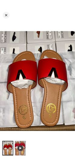 Effortless DF slide mules in vibrant red with a gold-tone V accent.