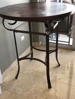 Sturdy bistro table (39.5" high, 34" wide), almost never used and in perfect condition. Hardwood top.