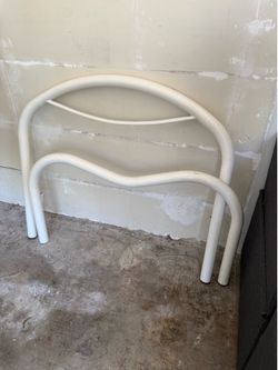 White twin bed frame with mattress