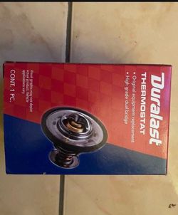 Water pump and thermostat on sale