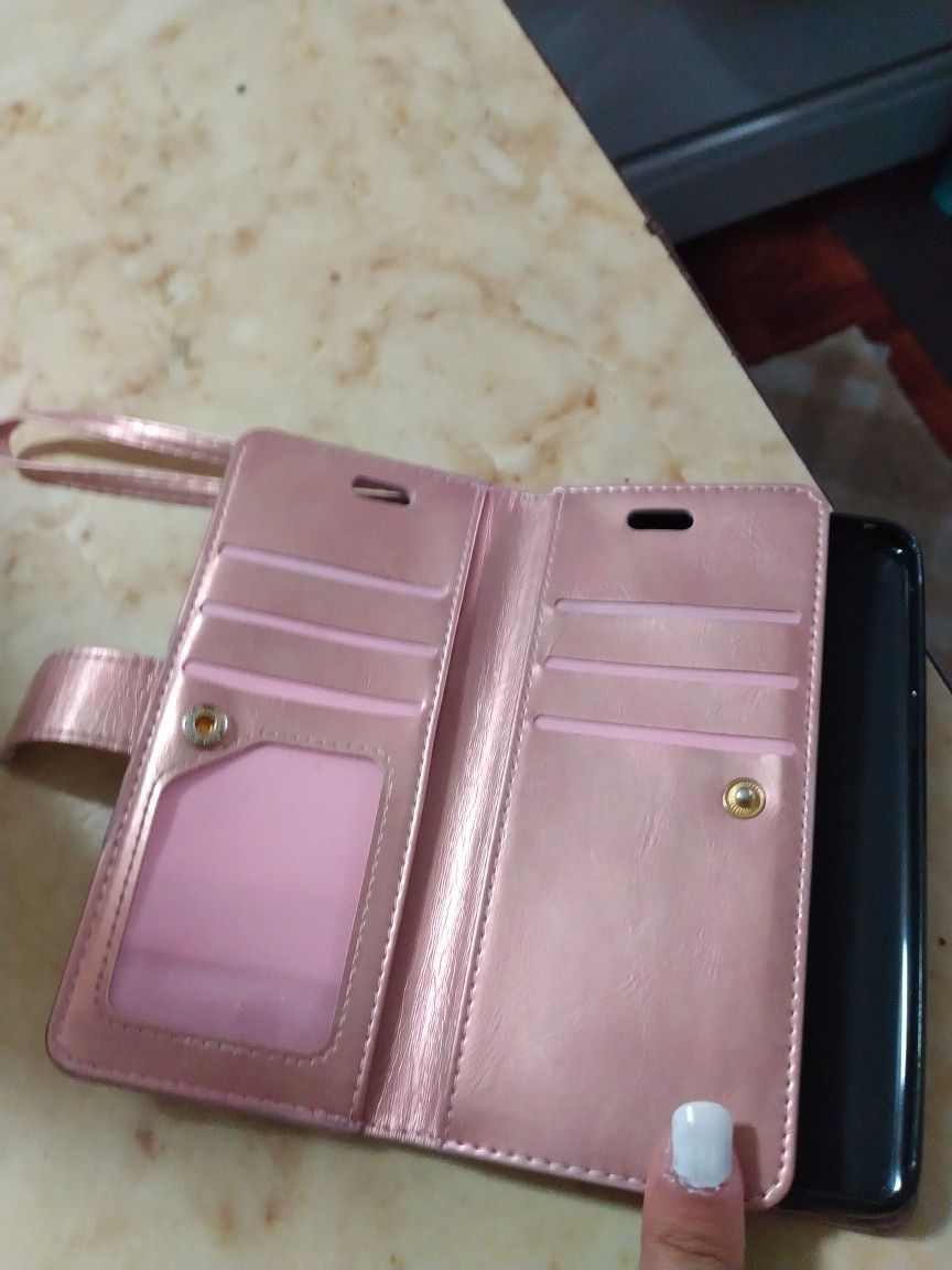 Used Samsung Galaxy s9 with a wallet case and regular case