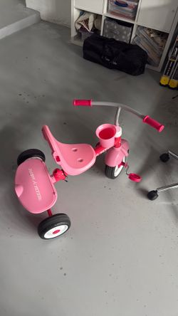 Pink Radio Flyer tricycle
