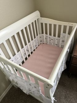 Crib with mattress. Includes: mattress cover and sheets ( girl or boy) I have both