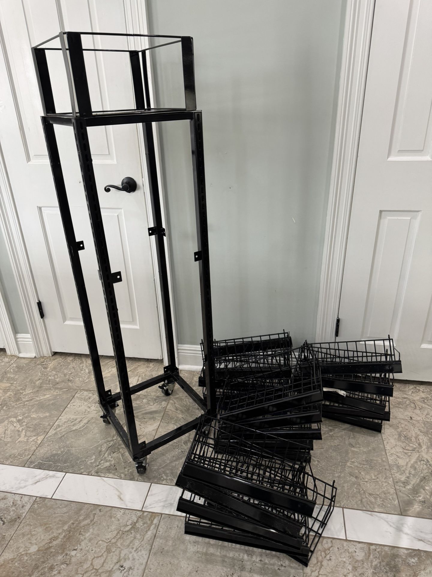 Strong and has wheels for better movement  Has 20 shelves  For storages and garage is great Shelves measured  L-14” W-9”. Alls are in metal