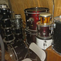 Two Sets Of Drums With Legs And Seat 
