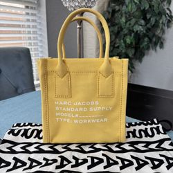 Marc Jacobs Small Canvas Standard Supply Tote in yellow.