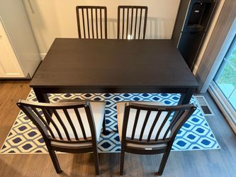 Ikea dining table with 4 chairs, extendable up to 6 seater