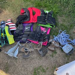 4 Adults Two Children’s Life Jacket, And Four Boat Weights
