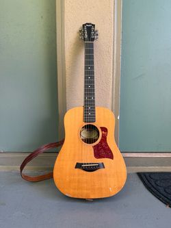Baby Taylor guitar with soft case, 2 capos, pick set, strings