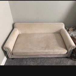 Tan Dog Sofa. 