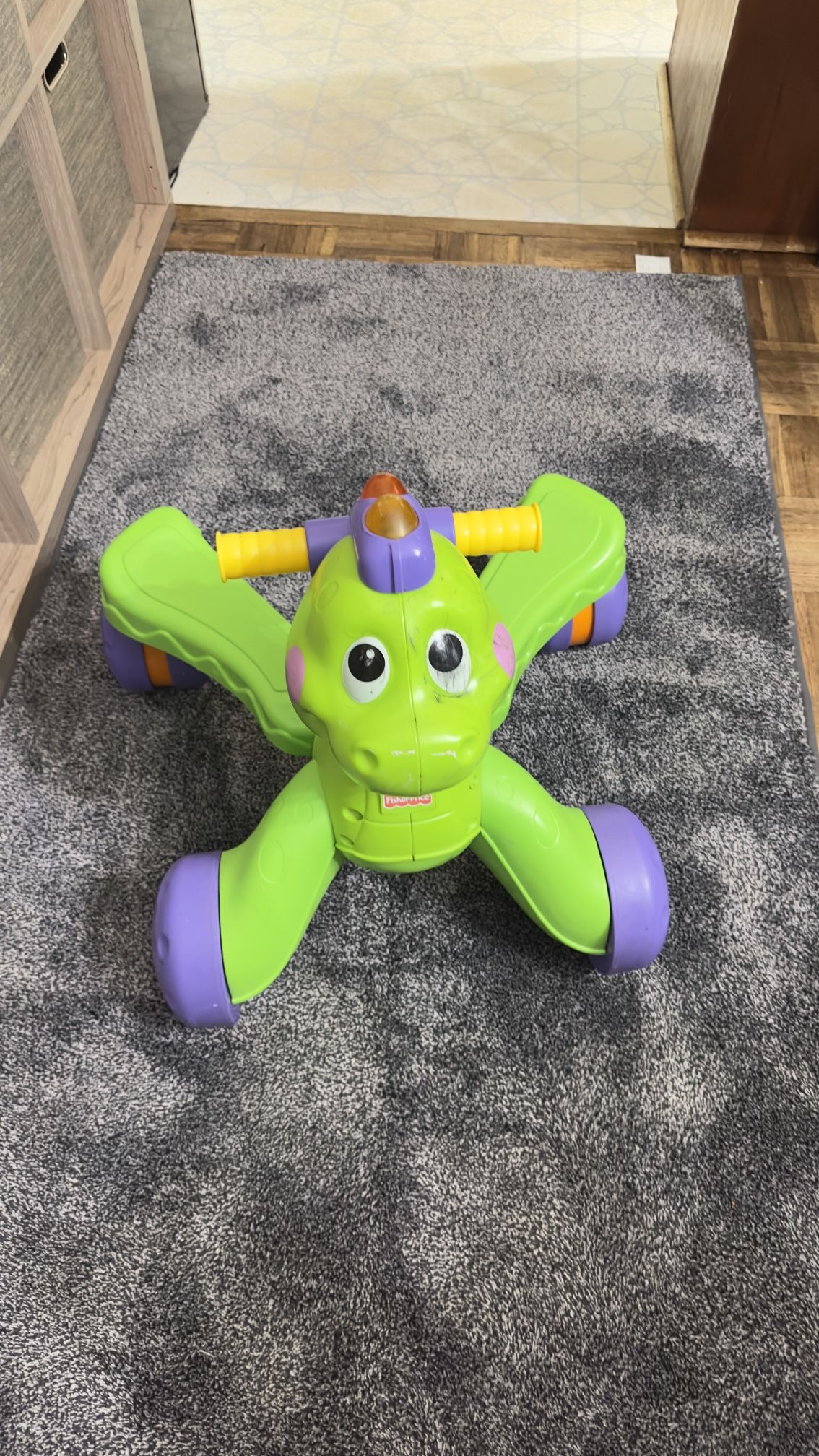 1️⃣ Fisher-Price Green Dino Ride-On Toy