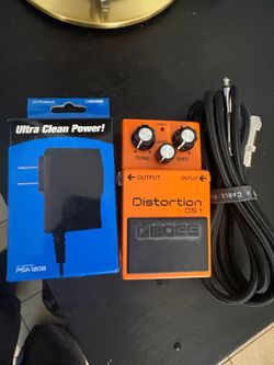 Distortion pedal BOSS DS-1 with AC adaptor and input/output cord for guitar