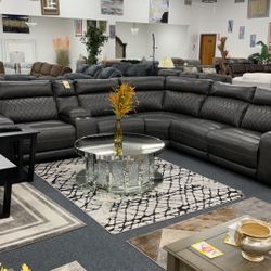 Electrice Leather Reclining Sectional With Cupholders And USB Plug In $2599