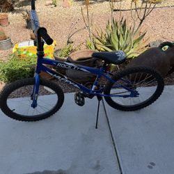 Huffy Rock It 20-inch Kids' Bicycle in royal blue. 