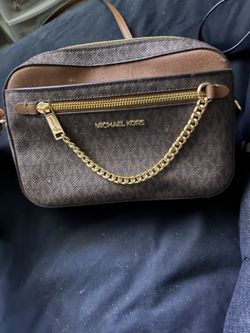Two Micheal Kors purse one brown and one black