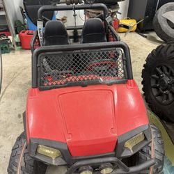RZR Power wheels.  No batteries included.  I ran it off 2 18volt milwaukee batteries for my son, much better than the stock set up.