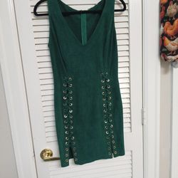 Hunter Green dress that laces up the sides and  is form fitting. Soft feeling almost like suede. Fashion House Brand Approximately a size 6-8