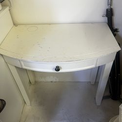 White vanity towers with table and mirror