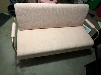 Pink couch with gold trimming