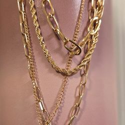 4 chain layered gold-tone chain with a crystal and disc pendant 