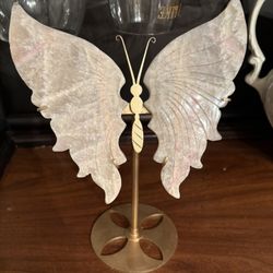 Peach moonstone butterfly wings with stand. Small amount of pink dye