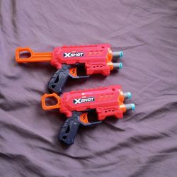 Two Dart Guns With Darts