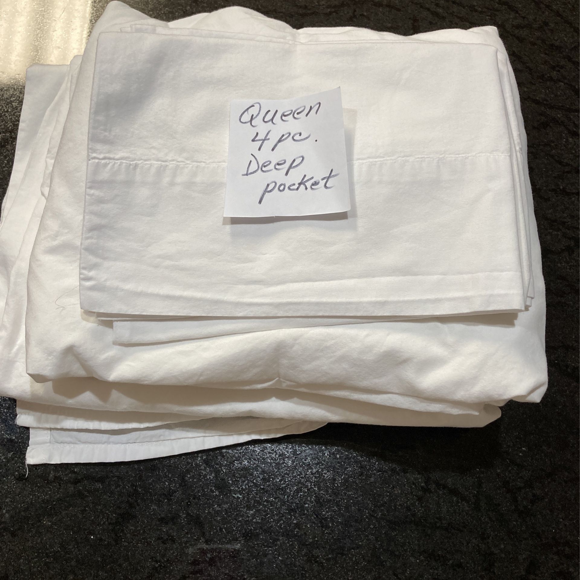 Two sets of queen size deep pocket sheets. 